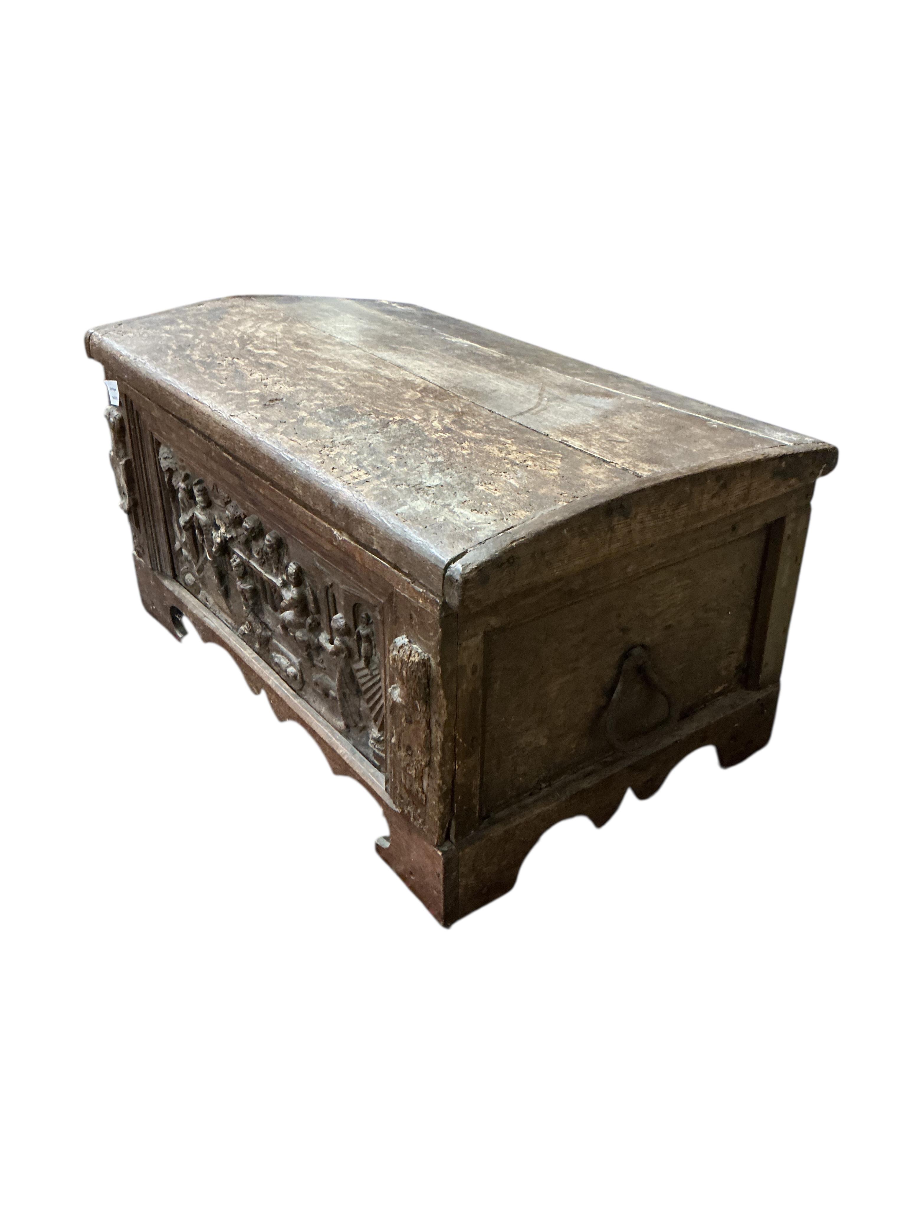 A small 17th century style carved oak domed top trunk, width 79cm, depth 50cm, height 41cm